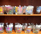 Trial vials of various artisan clean perfumes and pheromones on display in our magickal marketplace store.