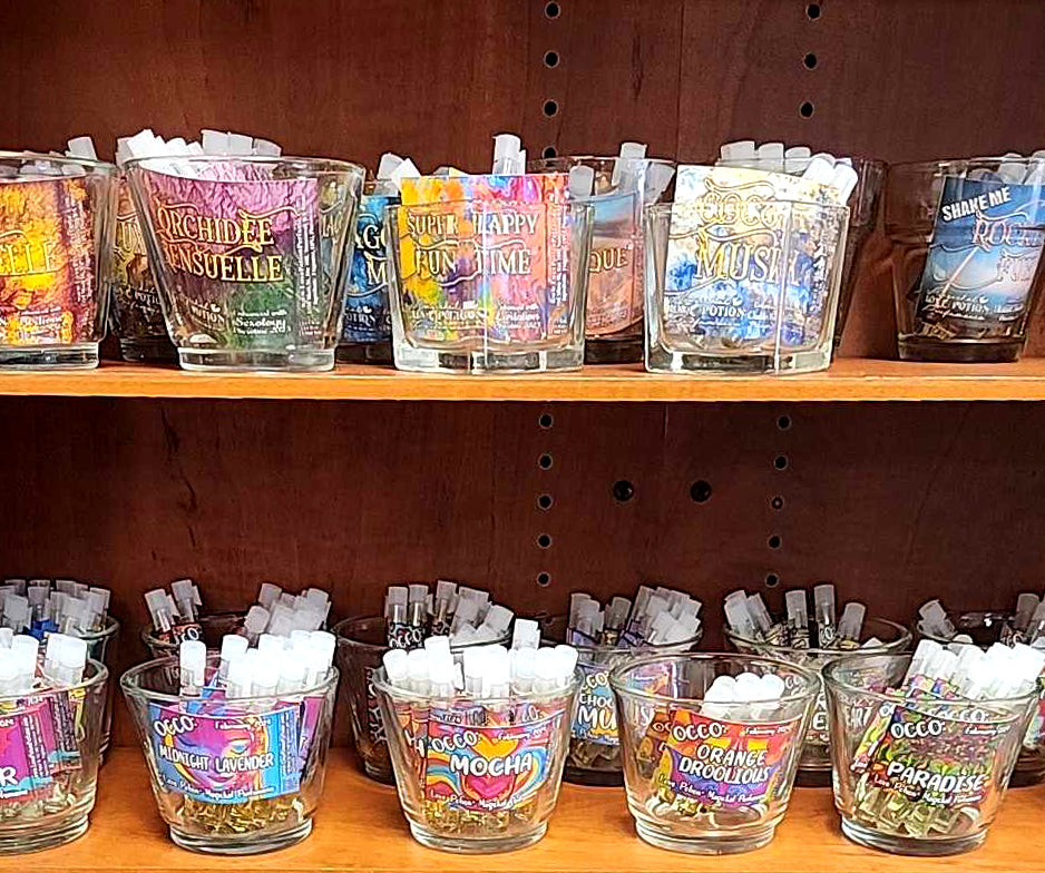 Trial vials of various artisan clean perfumes and pheromones on display in our magickal marketplace store.