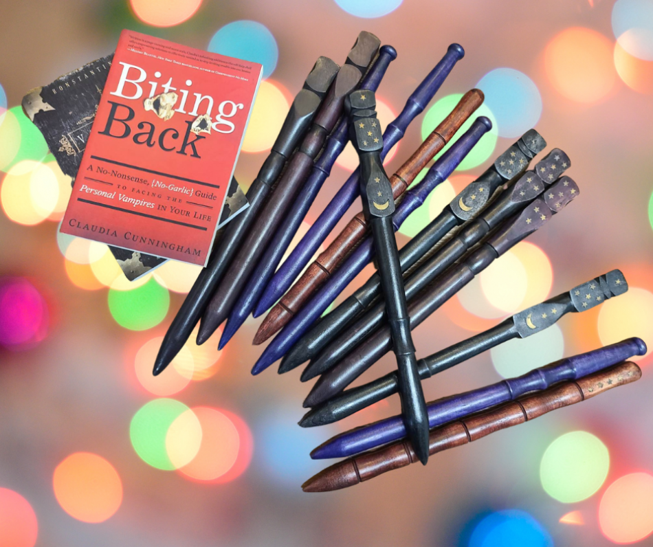 The image displays several vampire stakes and a book solely dedicated to vampires.