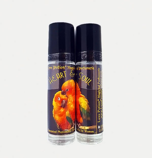 Love Potion Pheromone label featuring a pair of colorful birds snuggling, showing labelled product of glass bottle.