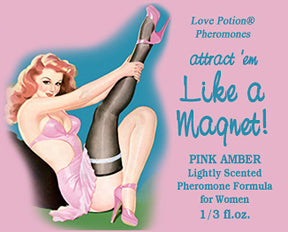 Like a Magnet pheromone oil with pink amber fragrance label shows a pinup girl in pink and black